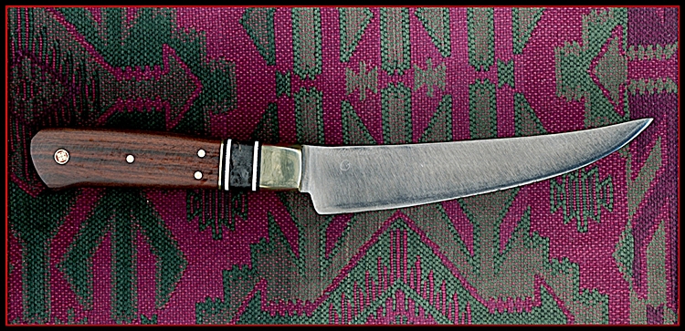 7" x 1.5" scimitar shaped Boning knife. 