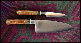 1" X 4" KITCHEN KNIFE AND 2.5" X 6" SANTOKU. EXTRA FANCY UPGRADE USING GREEN DYED BOX ELDER BURL WOOD AND STERLING SPACER. WOOD IS ANCIENT WALNUT. CARBON STEEL, BRASS BOLSTERS.