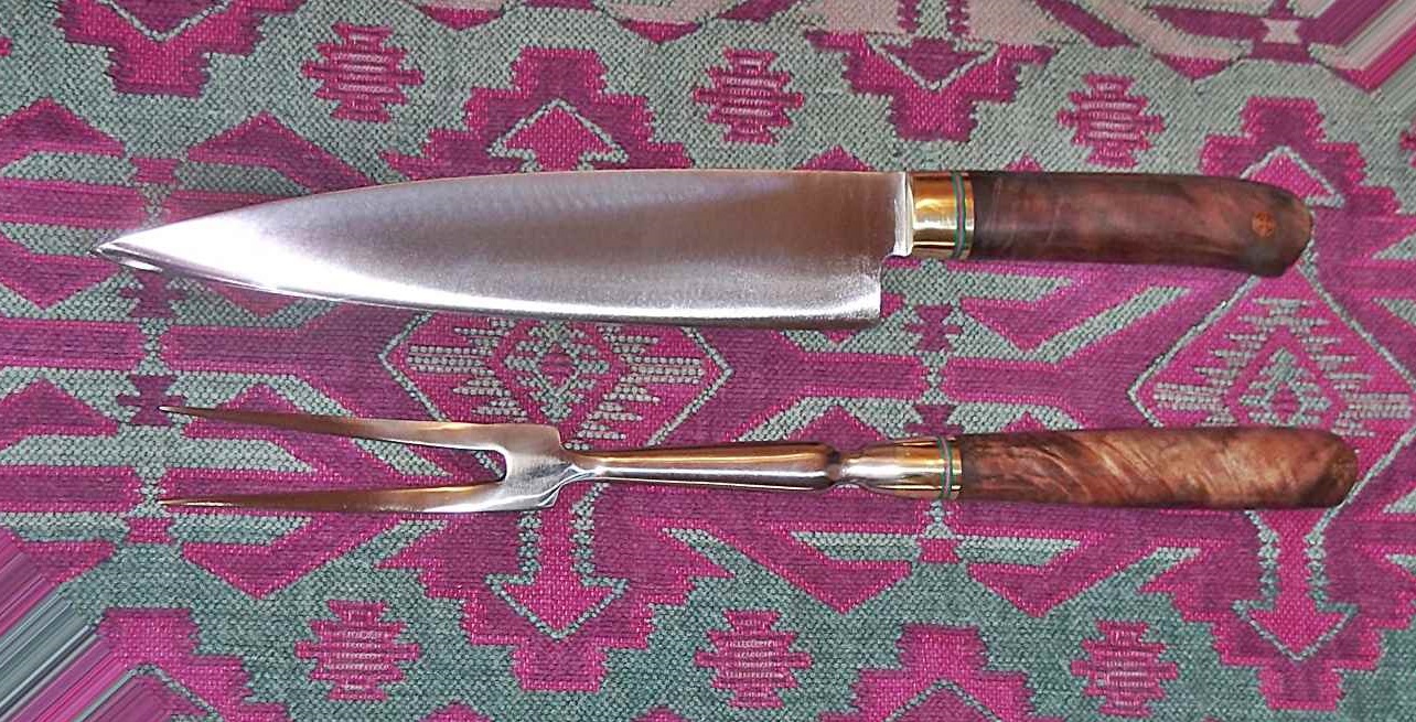 9" carving knife and stainless fork.  ~