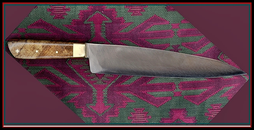 10 x 2" Sujihiki with stabilized Silky Oak Handle, brass bolsters, carbon steel.