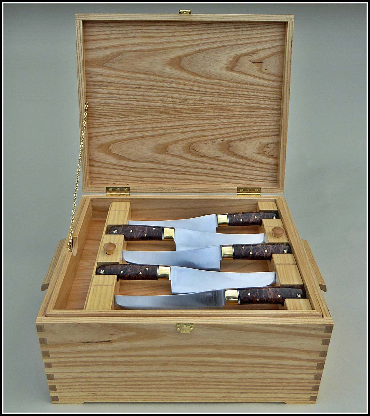 Chest opens to removable tray of 5 Carving knives 